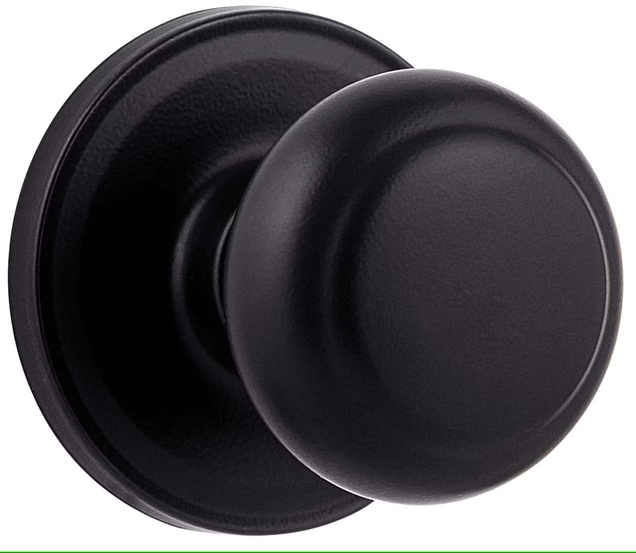 A close-up of a round, black door knob with a simple design, mounted on a circular base.