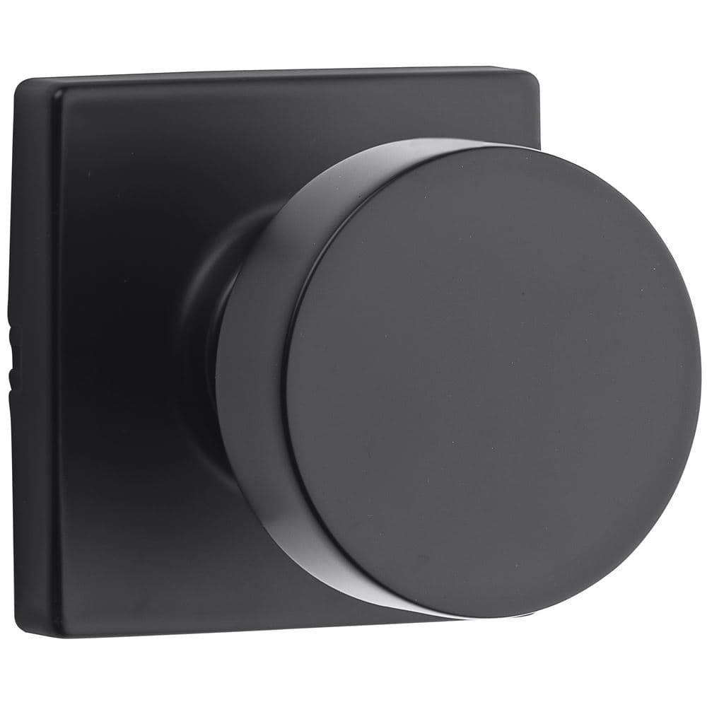 A matte black door knob with a square base.