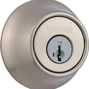 Close-up of a round, silver Weiser deadbolt lock with a keyhole in the center.
