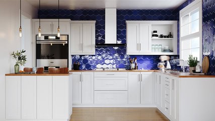 A modern kitchen with white cabinets, wooden countertops, and a blue tiled backsplash. There are pendant lights, a built-in oven, and various kitchen items on the countertops.