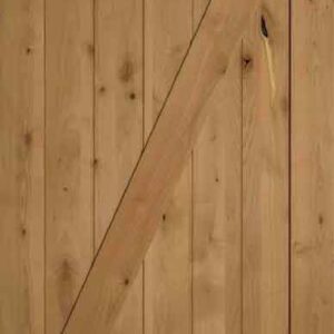 A wooden door with vertical planks and a diagonal Z-brace design.