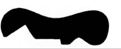 Abstract black shape on a white background, resembling an irregular silhouette with curves and angles.