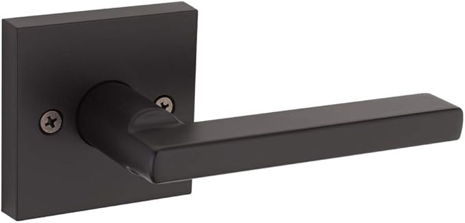 A matte black door lever handle attached to a square backplate with two visible screws.