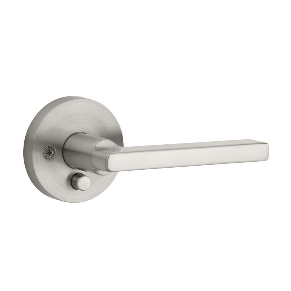 A silver metal door handle with a round base and a lock button on the side.